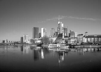 scenic view to skyline of Frankfurt am Main with reflection of the skyline in river Main.