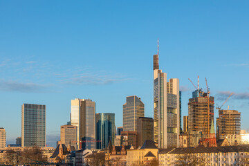 Fototapeta na wymiar scenic view to skyline of Frankfurt am Main with reflection of the skyline in river Main
