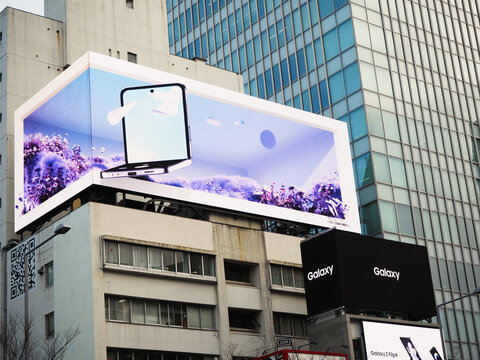TOKYO, JAPAN - March 1, 2023: A 3D billboard featuring an advert for the Samsung Galaxy Z Flip4 on a building in Tokyo's Omotesando area.
