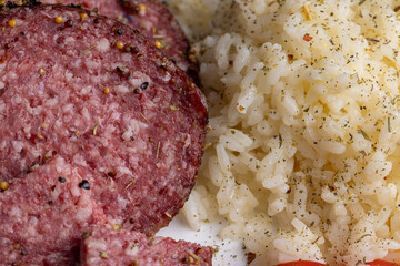 Cooked cooked crumbly rice with sausage