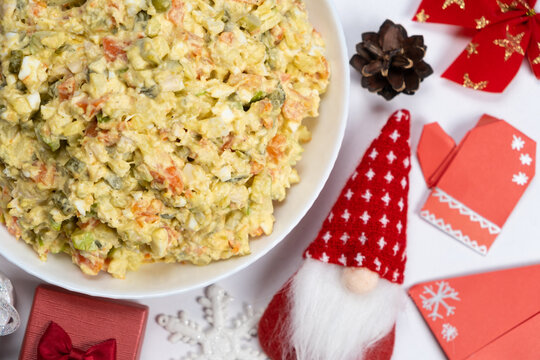 Olivier Russian salad on a Christmas and New Year background, top view.