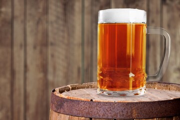 Pint glass of beer in bar on the desk