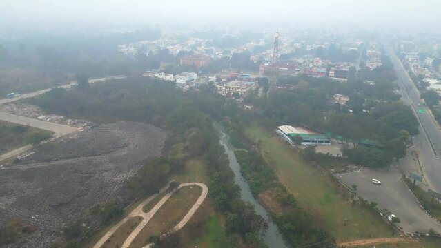 early morning Punjab city bird eye view Mohali India drone shot winter fog