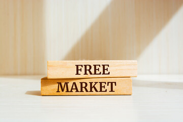 Wooden blocks with words 'Free Market'. Business concept