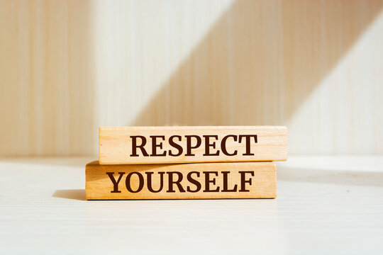 Wooden blocks with words 'Respect Yourself'.