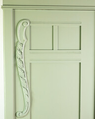 Decorated wardrobe after renovation in mint color
