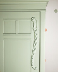 Decorated wardrobe after renovation in mint color
