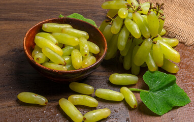 Natural organic different types of fresh ripe juicy grapes and space for text on table. top view, Agriculture concepts.