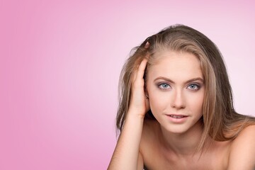 Obraz premium Happy young woman after facial treatment.