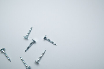 Set of metal nail head isolated on white background. Metallic nail for joining wooden detail. Handcrafted metal nails