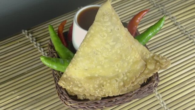 Potato samosa on with Sauce or Tomato Ketchup, Traditional indian or pakistani ramadan food, Ramzan iftar meal, Spicy street food, Famous snacks in asian country.