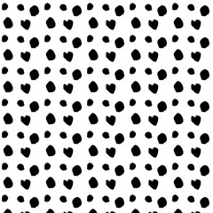 Seamless pattern of dots drawn with a brush. black and white dots