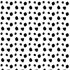 Seamless pattern of dots drawn with a brush. black and white dots