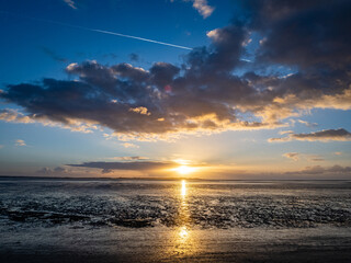 Sunset in winter in French Baie de Somme in Picardy during low tide