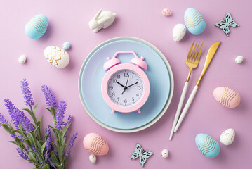 Easter celebration concept. Top view photo of blue plate with pink alarm clock knife fork colorful...