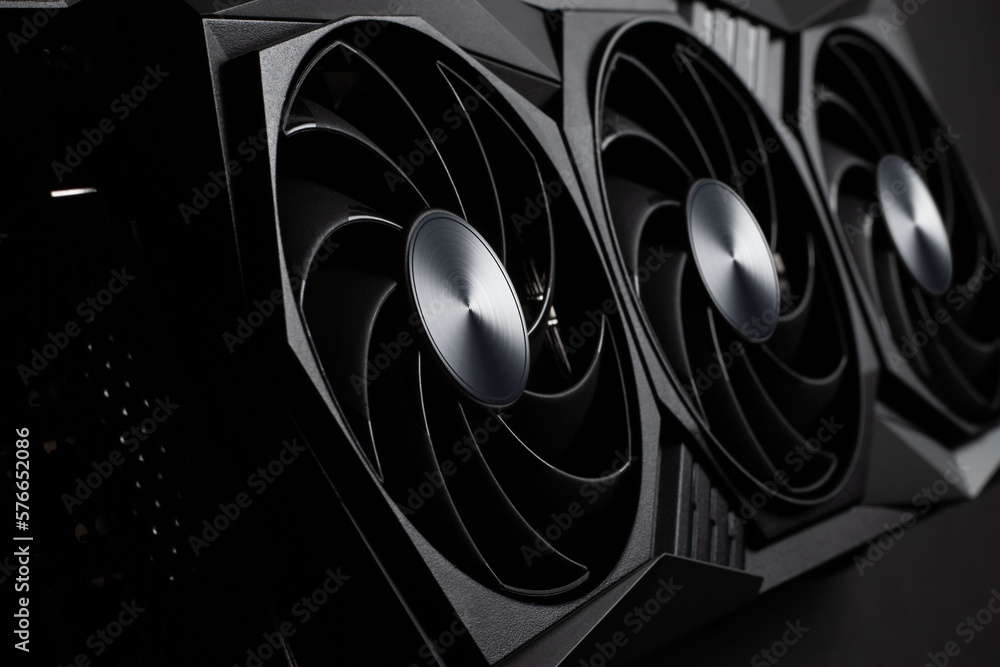 Aufkleber video card with three coolers from the computer on a dark background.concept computer harware.
