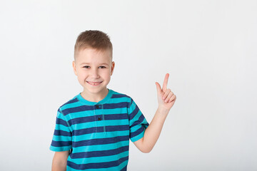 The winning child, highlighted on a white background, will show his emotions. Isolated on a white background.