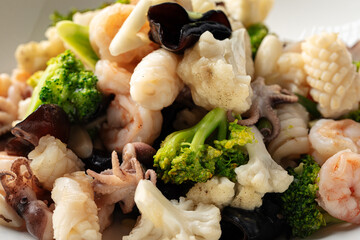 Closeup on portion of gourmet assorted seafood dish