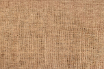 Canvas fabric texture background or Natural brown cloth surface.