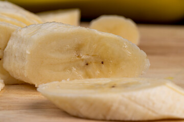 a ripe sweet banana cut into pieces lies on the table