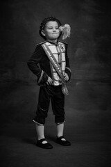 Black and white portrait of little boy dressed up as medieval character, little prince and pageboy....