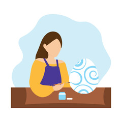 Woman coloring an easter egg