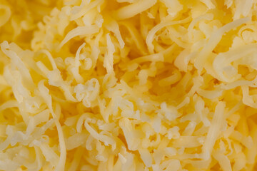 Hard cheese with holes grated into thin small slices