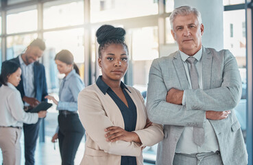 Serious, business people and portrait with arms crossed in leadership meeting, collaboration or teamwork at office. Confident corporate executive leaders standing in company management at workplace