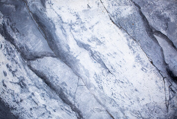 Background Stone wall background with abstract spots. Beautiful gray marble texture with stains, abstract surface background. Finishing stone for building cladding. Furniture granite.