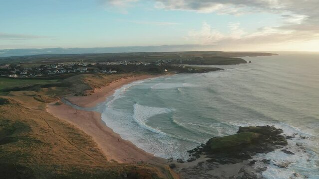 Aerial view of Constantine Bay at sunset during hightide, Cornwall, United Kingdom.