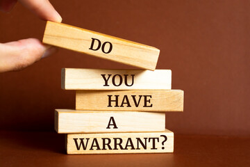 Wooden blocks with words 'Do You Have a Warrant?'. Business concept