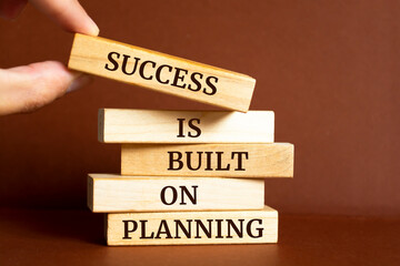 Wooden blocks with words 'Success is Built on Planning'. Business concept