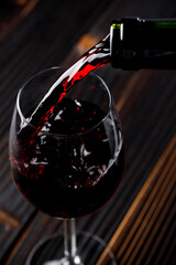 Red wine pouring in a wine glass