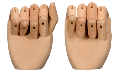 A human hand made of wood on a white background. Fingers can be bent.
