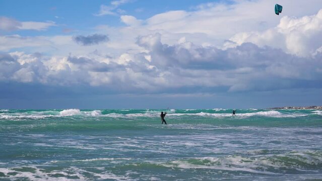 Kate surf, in Puglia, jump of the athlete on the rough sea 2