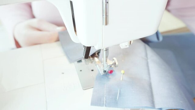 Time lapse. Sewing cotton face mask with a sewing machine for coronavirus outbreak.