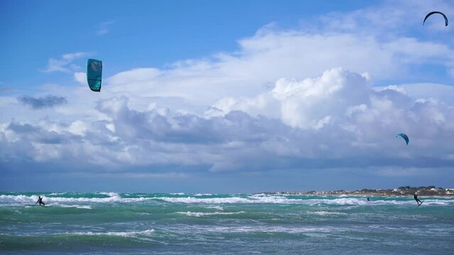 Kate surf, in Puglia, jump of the athlete on the rough sea 3