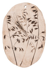A clay tablet with the shapes of grasses and cereals reflected.