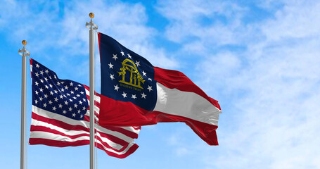 The Georgia state flag waving along with the national flag of the US