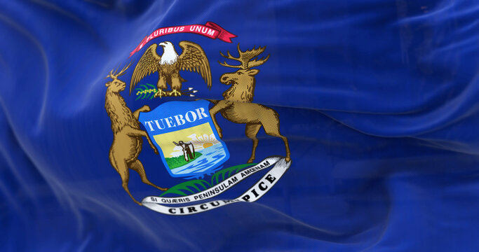 Close up view of the Michigan state flag waving