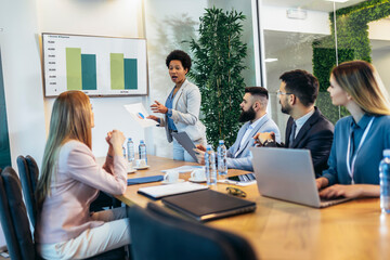 Fototapeta premium Business people having a meeting or presentation and seminar in the office. Portrait of a young business woman leader