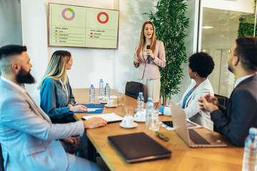 Business people having a meeting or presentation and seminar in the office. Portrait of a young business woman leader