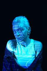 Abstraction and illusion. Portrait of young blonde girl with neon stripes on face posing over dark background in blue neon lights. Concept of art, modern style, cyberpunk, futurism and creativity