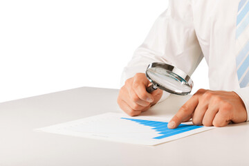 Fototapeta premium Reviewing results. Business with Magnifying Glass; and chart