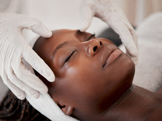 Black woman, face and sleeping in spa facial for beauty skincare, massage or relaxing in treatment....