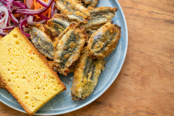 fried anchovy fish with corn bread
