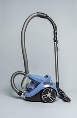Vacuum cleaner on a neutral background. Cleanliness and cleaning.