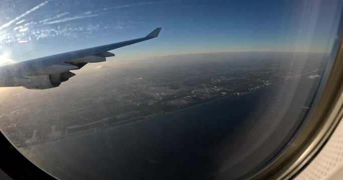 Airplane landing in Miami 4k. Flying over Miami. View of east coast from plane's window.  