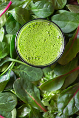 Overhead view of fresh and nutritious homemade green juice made from leafy greens