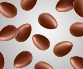 Many chocolate eggs falling on light grey background